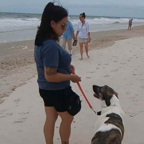 Amanda with River Amanda at Jacksonville Beach with a dog who was aggressive towards humans